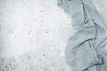 Grey background with grey textile napkin.