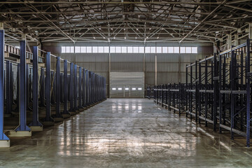 Warehouse of engineering plant shop. Interior of empty storage of metalwork production hall.