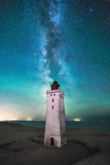 Tuinposter Lighthouse Rubjerg Knude at night with Milky Way above it. High quality photo © Florian Kunde