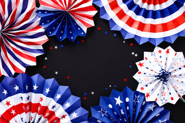 Paper fans and confetti on black background. USA patriotic decorations. Happy Independence Day, 4th of July, Labor Day, Memorial Day concept.