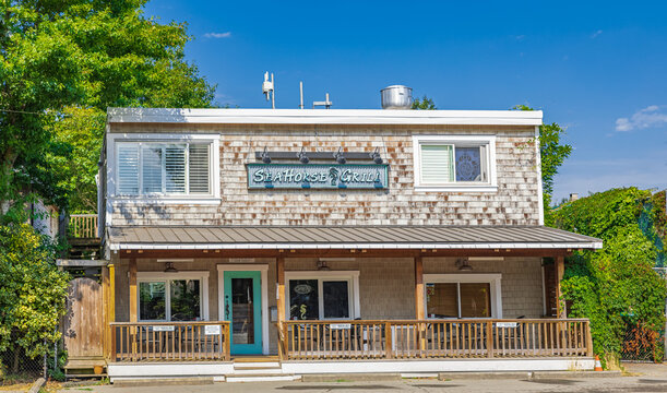 Beautiful exterior of The Sea Horse Grill, a typical restaurant pub in White Rock BC in sunny summer day