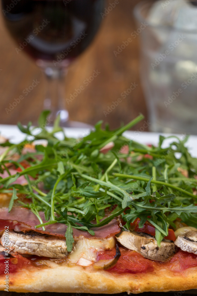 Sticker pizza with fresh arugula