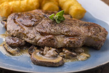 pork steak on mushroom sauce