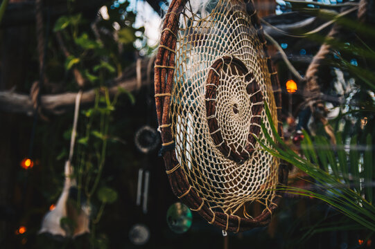 Handmade Dream Catcher With Ornaments In Natural Green Background In Mexico