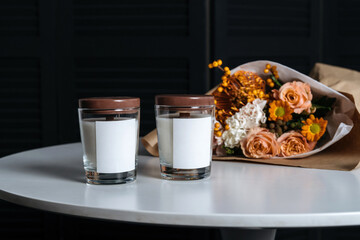 Handmade candle from paraffin and soy wax in glass with wooden wick and dry herbal. Vertical photo