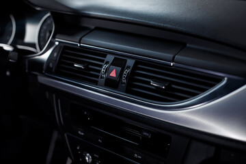 Close-up of air vent in car. Dashboard in modern car interior.