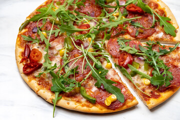 Pizza pepperoni with salami and arugula 