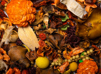 autumn mood. Background on the autumn theme. Sunny theme. Dry fallen leaves and flowers mixed with fruits and nuts