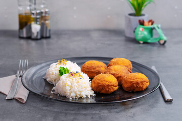 Champignon mushrooms in breadcrumbs, breaded mushrooms with steamed rice