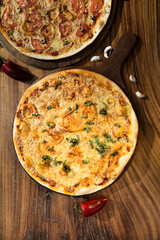 Italian pizza. Cheese and tomato. Potato and green onion. Italian restaurant.