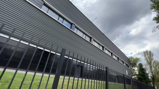 Modern Factory Office Building Exterior, Covered With Black Metal Building Cladding. Extreme Wide Angle Shot