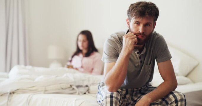 Sad couple, bedroom and fight after communication problem or divorce threat with difficult news. Toxic relationship, depression and anger about partner cheating secret and lies in marriage.