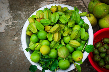 Green Carambola or Star Fruit and Lemon in the Market
