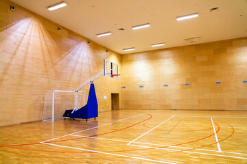 Goals for mini-football and a mobile movable basket in basketball sports hall 