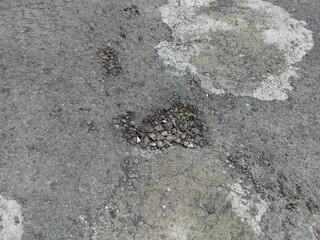 potholed asphalt road