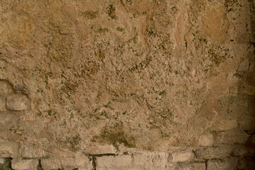 closeup yellow wall plastered bricks texture background