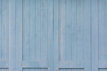 Obraz na płótnie Canvas Porte de garage en bois, peinte en bleu