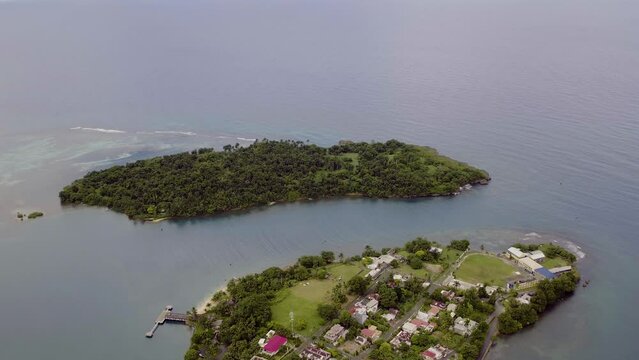 Aerial view of Navy Island in Port Antonio in Jamaica with Titchfield school and the old hotel on the tip between the east and west harbour on a peaceful calm morning.
