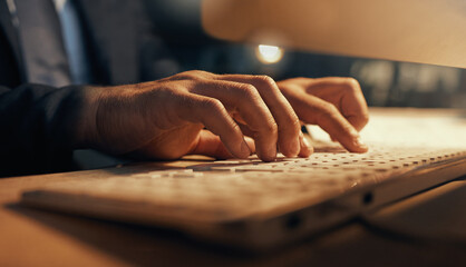 Hacker, web developer or software designer typing on computer keyboard for research, coding or programming. Closeup hands of a man internet browsing while working late night on cyber security code