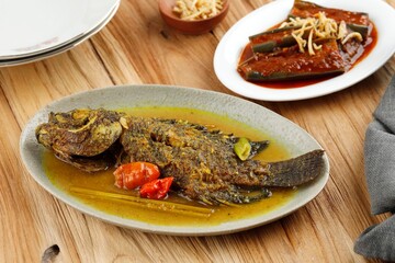 Spicy Gourami Fish Stew in Yellow Curry Spice. Thai and Indonesia Style