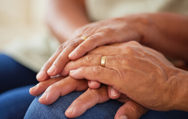 Couple holding hands for support and love, gratitude for help and support and kindness in retirement in home. Elderly friends or senior people with respect, community and hope in marriage