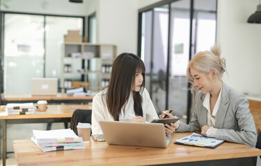 Asian businesswoman using calculator and financial documents at the table office, business financial concept.