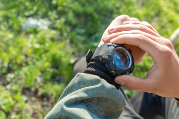 Close-up hand watch, looking at his watch on his hand, watching the time.