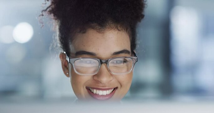 Business, office and woman working on a computer with a happy face and smile at work from good news. Female corporate employee worker in success with technology smiling in happiness at the workplace.