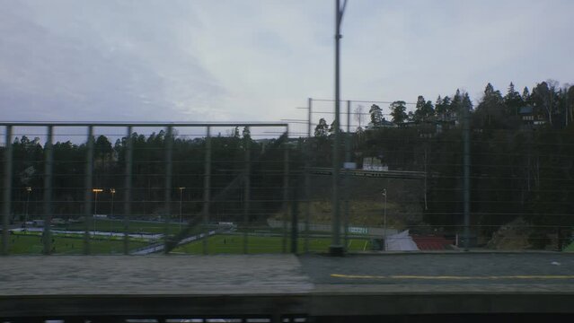 School Soccer fields seen from train to Oslo Vinterpark 2, Grakammen, Sentrum city centre