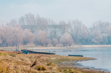Danube Island Sodros near Novi Sad, Serbia. Gray and white landscape with frozen water.