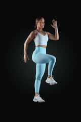 Shot female gymnast performing exercise postures for an app and online classes