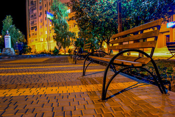 Fototapeta na wymiar Empty benches in the park at night 