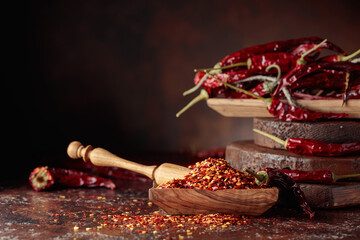 Obraz na płótnie Canvas Chilli flakes and dried chili peppers.