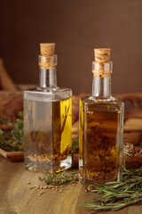 Bottles of olive oil with herbs and spices.