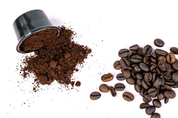 coffee beans vs ground coffee or in capsules,pods.roasted brown coffee beans in plastic opened pod.isolated on light blue pink background.sunshine,sun shadows.ground coffee from pod spread on surface.