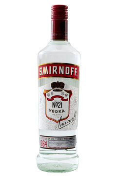 Croydon, UK - February 17, 2022: Illustrative editorial of glass bottle of Smirnoff vodka isolated on white background
