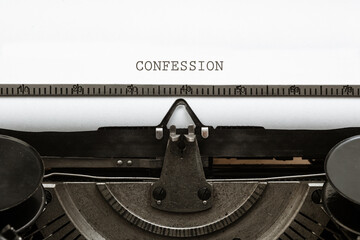 Confession headline written on vintage type writer from 1920s