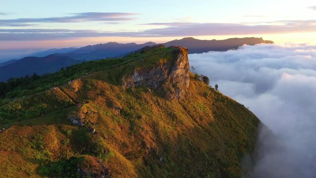 Sunrise and Mist mountain in Phu Chi Fa located in Chiang Rai, Thailand. Phu Chi Fa is the natural border between Thailand and Laos