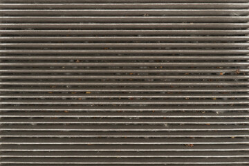 Obraz premium Used car cabin charcoal air filter texture background. Dirty carbon car air filter with dust pattern.