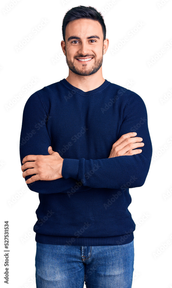 Wall mural young handsome man wearing casual clothes happy face smiling with crossed arms looking at the camera - Wall murals