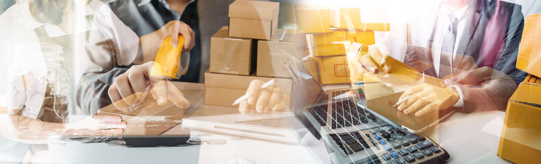 Startup small business entrepreneur or freelance Asian woman using a laptop with box, Young success Asian woman with her hand lift up, online marketing packaging box and delivery, SME concept.