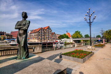 Three Graces - statues on the Brda waterfront in Bydgoszcz, Kuyavian-Pomeranian Voivodeship, Poland. - obrazy, fototapety, plakaty