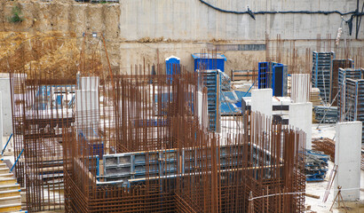 Construction site. Reinforcement with metal bars for pouring concrete.