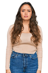 Obraz premium Young hispanic girl wearing casual clothes depressed and worry for distress, crying angry and afraid. sad expression.