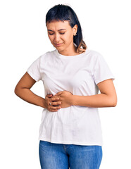 Young woman wearing casual clothes with hand on stomach because nausea, painful disease feeling unwell. ache concept.