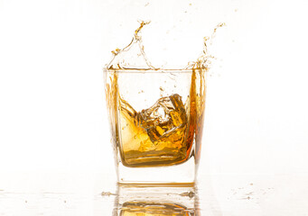 Isolated shot of whiskey with splash on black background