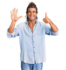 Young hispanic man wearing summer style showing and pointing up with fingers number six while smiling confident and happy.
