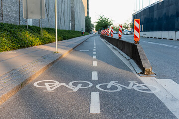 White bicycle symbols on the asphalt marking the bicycle lanes