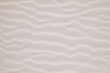 Sand on the North Sea. Sand sculpted into wavy shape by the wind. Windy Beach.