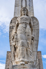 Outdoor stone statue of a goddess angel on the Obelisk of Horea, Closca and Crisan in Alba Iulia, Transylvania, Romania